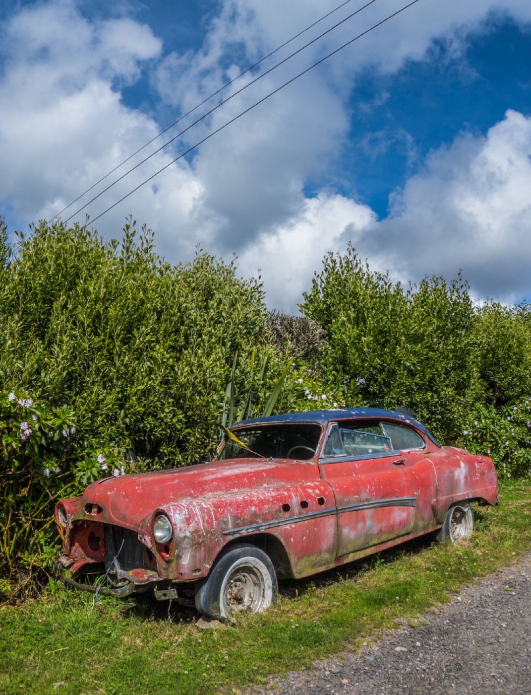 Rusty end-of-life vehicle ready for removal