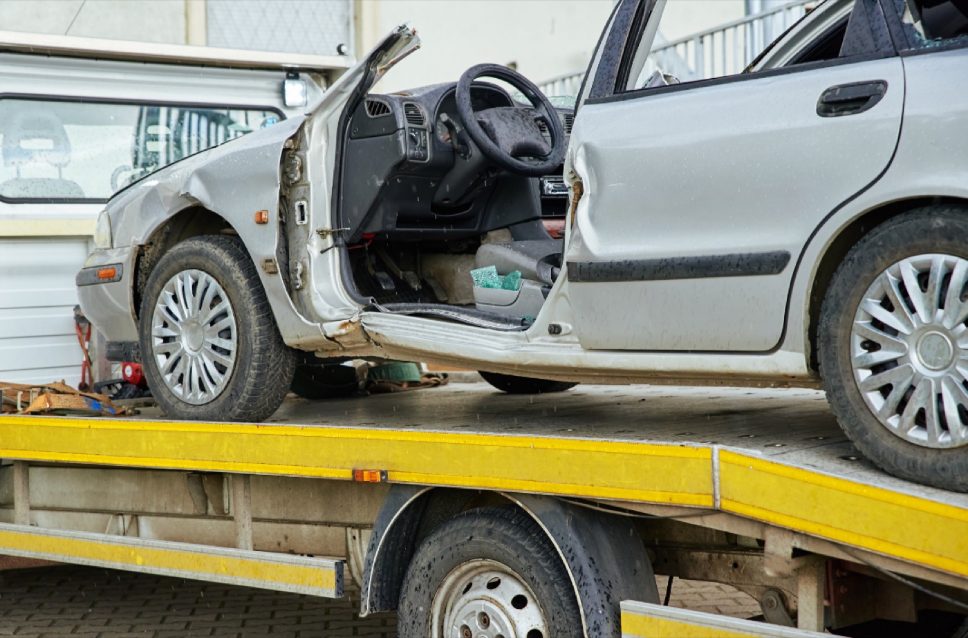 Wrecked vehicle being collected for recycling
